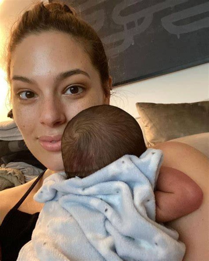 Ashley Graham carries her son as she leaves a restaurant in New York City