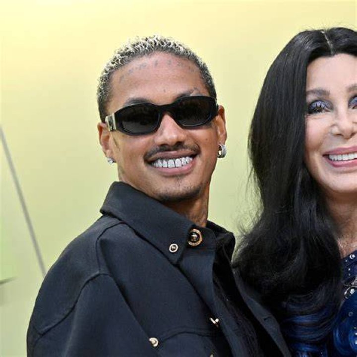 Cher and Boyfriend Share Passionate Kiss During Red Carpet Debut Parade